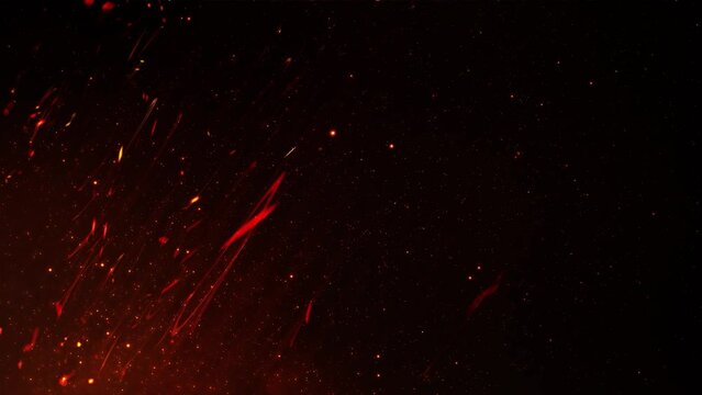 Red glowing flying embers burning on black background. Background with sparks of fire with added graphic effect.