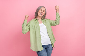 Photo funny awesome businesswoman elderly wear trendy outfit victory fists up lucky winner hooray...