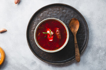 Traditional Ukrainian beet soup - borscht on the grey background, top view copy space for text
