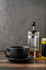 Freshly brewed hot winter tea on a wooden table