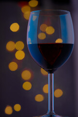 glass of wine and christmas light