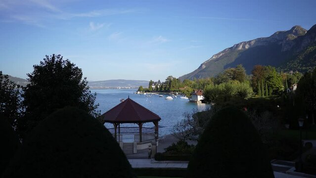 Gazebo and other lake shore structures in Lake Annecy in the French Alps, Locked shot