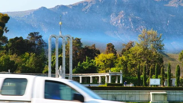 Huguenot Monument in Franschhoek, South Africa. Street view mountain background