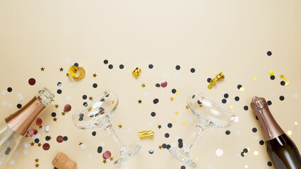 Concept of party celebration, New Year. Champagne bottles and glasses with confetti and gold stars. Top view, copy space, flatlay
