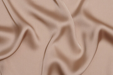 texture crumpled or wrinkled beige polyester or synthetic fabric close-up. Image for your design. material for sewing clothes - obrazy, fototapety, plakaty