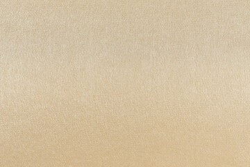 close-up texture yellow shiny synthetic fabric. background for your design or mockup. fabric for...