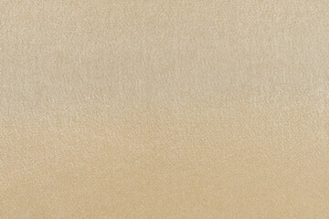 close-up texture yellow shiny synthetic fabric. background for your design or mockup