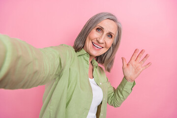 Photo of recording video selfie senior woman grandmother first video blogger tiktok media ad waving...