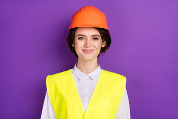 Photo of optimistic nice brunette hair lady wear builder uniform isolated on vivid purple color background