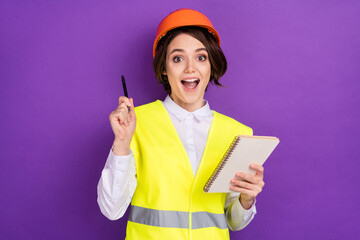 Photo of impressed nice brunette hair lady write wear builder uniform isolated on purple color...