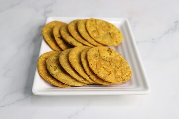 Crispy and crunchy methi mathri is a popular tea time snack in northern parts of India. It's especially popular during the Diwali festive season. It's a savory cracker made using Maida and Fenugreek. 