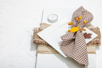 Autumn table setting. Thanksgiving cutlery, traditional fall decor. Cozy mood, minimalist design