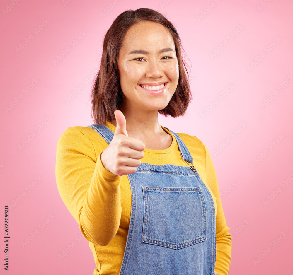 Poster Smile, thumbs up and yes with portrait of woman in studio for support, agreement and motivation. Winner, emoji and success with person on pink background for achievement, thank you and vote sign