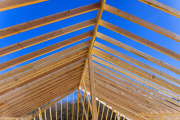 Constructing new house roofing frame with wooden support beams