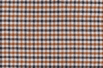texture fabric in a brownish black cell close-up. material for sewing skirts, shirts, textiles and...