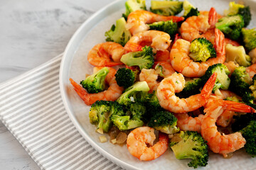 Homemade Garlic Broccoli Shrimp Stir Fry on a Plate, side view. Close-up.