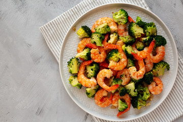 Homemade Garlic Broccoli Shrimp Stir Fry on a Plate, top view. Copy space.