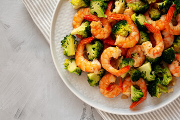 Homemade Garlic Broccoli Shrimp Stir Fry on a Plate, top view. Copy space.