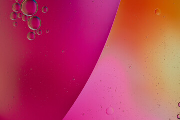 Top view oil bubbles drop on the water with colorful background, Macro photography concept