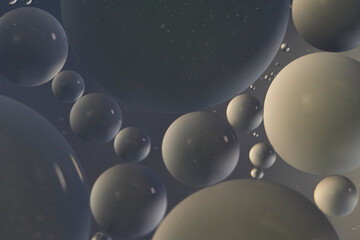 Top view oil bubbles drop on the water with colorful background, Macro photography concept