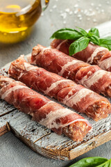 pork mince with bacon wrapped sausages. Food recipe background. Close up