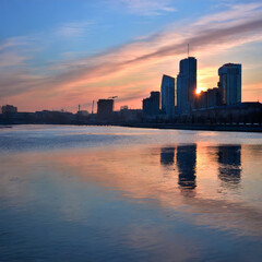 Sunset Over the Reflective City Skyline