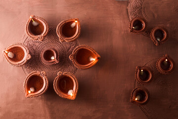 Burning diya on Happy Diwali, background for light festival of India