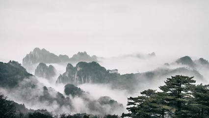 Cercles muraux Monts Huang Dramatic landscape of foggy mountains in the distance: Huangshan National park China