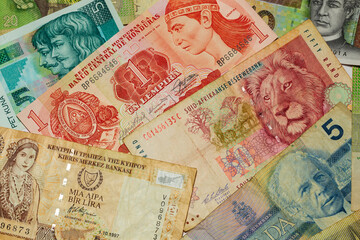 Fototapeta na wymiar Different kinds old Banknotes from the all World in the Detail
