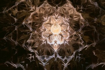Low angle of a chandelier hanging from the dome of a church