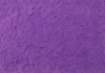 Purple plasticine texture background. Modeling clay material pattern.