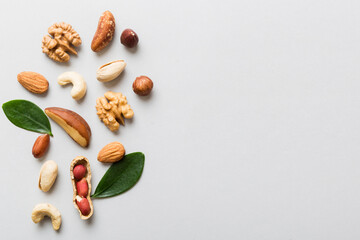 Composition of nuts , flat lay - mix hazelnuts, cashews, almonds on table background. healthy eating concepts and food background