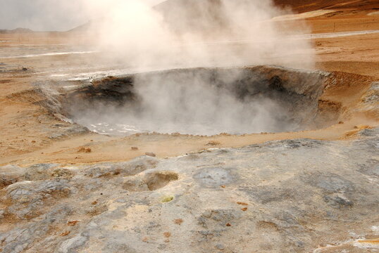 Smoking mudpool surrounded by sulphur crystals in Námafjall Geothermal Area, or Hverir, on the east side of Lake Mývatn in Northeast Iceland