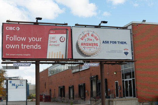 two billboards (one for CIBC and one for RE/MAX) located near CMP Meats, a permanently closed butcher shop located at 2255 St Clair Avenue West, Toronto, Ontario