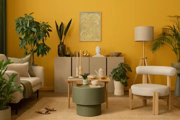 Foto op Plexiglas Creative living room interior with mock up poster frame, yellow wall, stylish armchair, green coffee table, beige sofa, stylish sideboard, sculpture and personal accessories. Home decor. Template. © FollowTheFlow