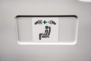 Airplane Seatbelt Sign Close Up