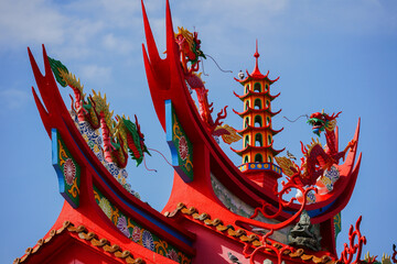 Chinese Temple Roof with Pagoda and Dragon Statues