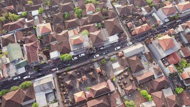 Aerial view of traffic jam in Denpasar, Bali, Indonesia. 4K footage. Crab left shot.