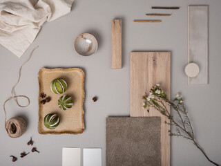 Creative flat lay composition with textile and paint samples, panels and cement tiles. Stylish...