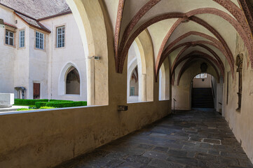 Obraz premium Novacella Augustinian Abbey. The Gothic cloister with from valuable frescoes, Brixen (Bressanone), South Tyrol, northern Italy, Juni 12, 2023
