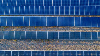 Rows of solar panels of different types of assembly. View from a drone