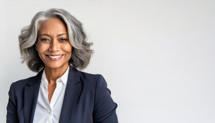 Smiling beautiful mature business woman standing isolated on white background. Older senior businesswoman, 60s grey haired lady professional coach looking at camera, close up face headshot portrait - obrazy, fototapety, plakaty