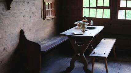 Wooden furniture in Chalet interior. detail close-up of rural farmhouse, table and chairs. Simple rustic living, handmade