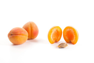 Apricot fruit whole and half isolated on white background..