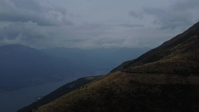Aerial footage of a group of hikers on the hiking trail on Grigna Meridionale mountain on Lake Como