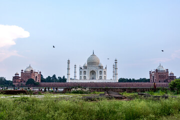 The imposing Taj Mahal in Agra, India, with its wonderful architecture on a cloudy day from a view across the river