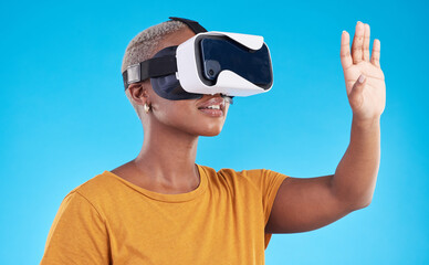Black woman, metaverse and virtual reality with future technology and 3D isolated on blue background. User experience, VR goggles and female person, digital world and software with gaming in a studio