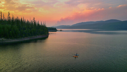 Aerial view of two paddleboarder on Hungry Horse Reservoir at su