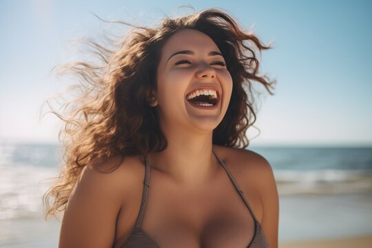 Young chubby black woman having fun at beach. Cheerful friends enjoying at sea.
