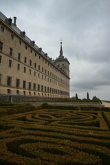 the building is made from stone with a maze around it